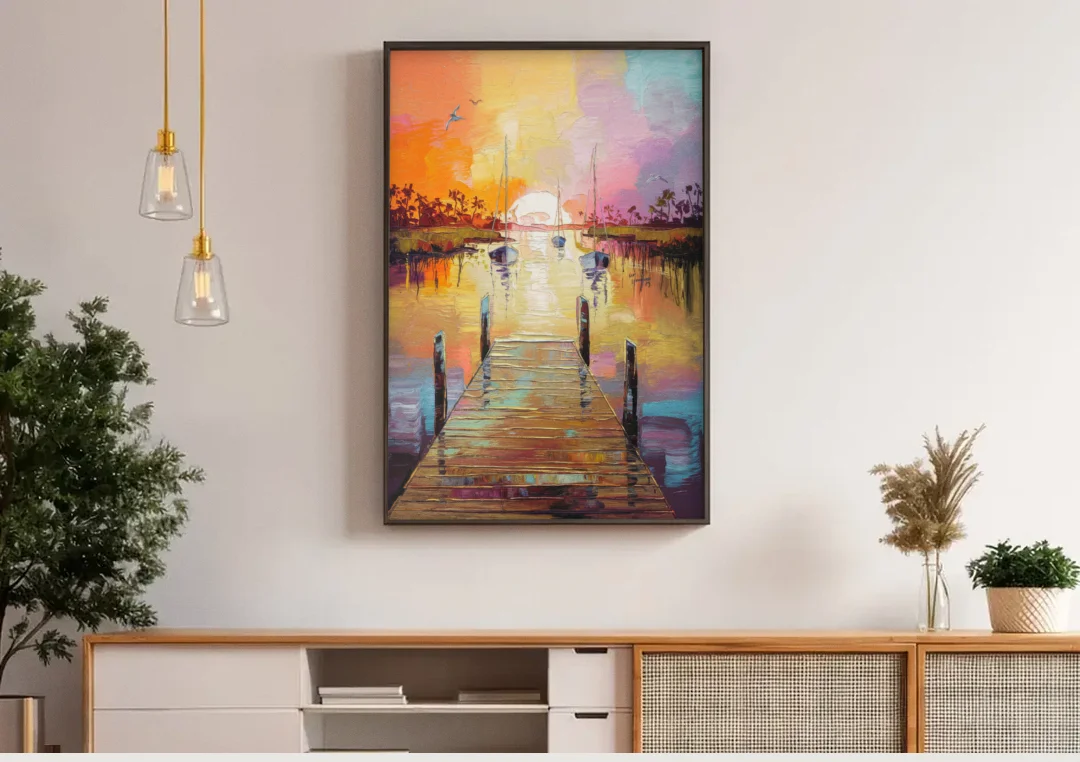Charleston Harbor at Sunset canvas wall art above a wooden sideboard under pendant lights