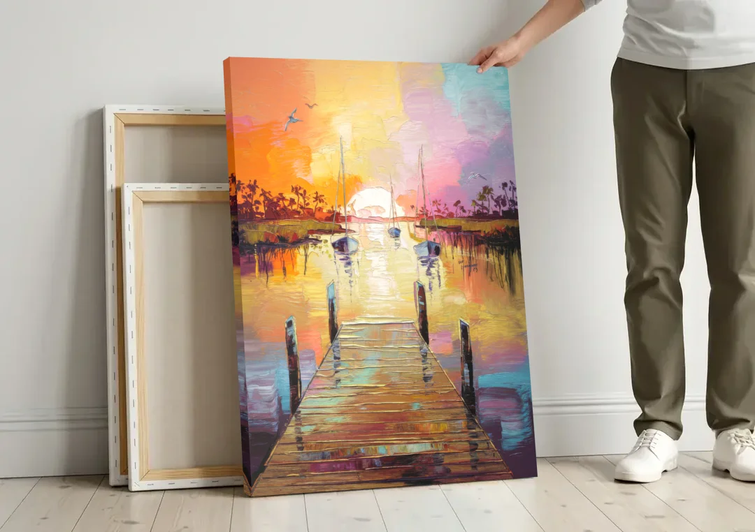 Charleston Harbor at Sunset canvas wall art leaning against a wall next to blank canvases