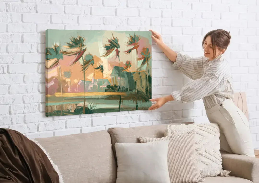 Charleston Palmetto Trees canvas wall art being hung on a white brick wall above a sofa