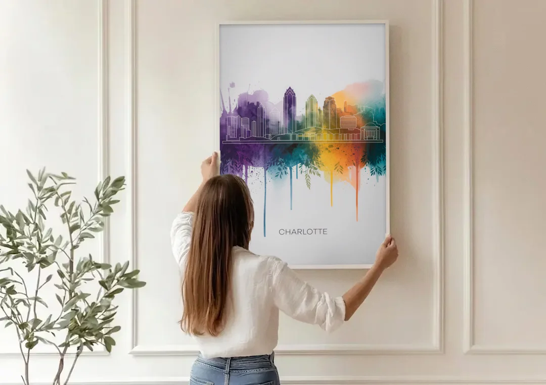 Charlotte Cityscape in Watercolor canvas wall art being hung on a paneled wall