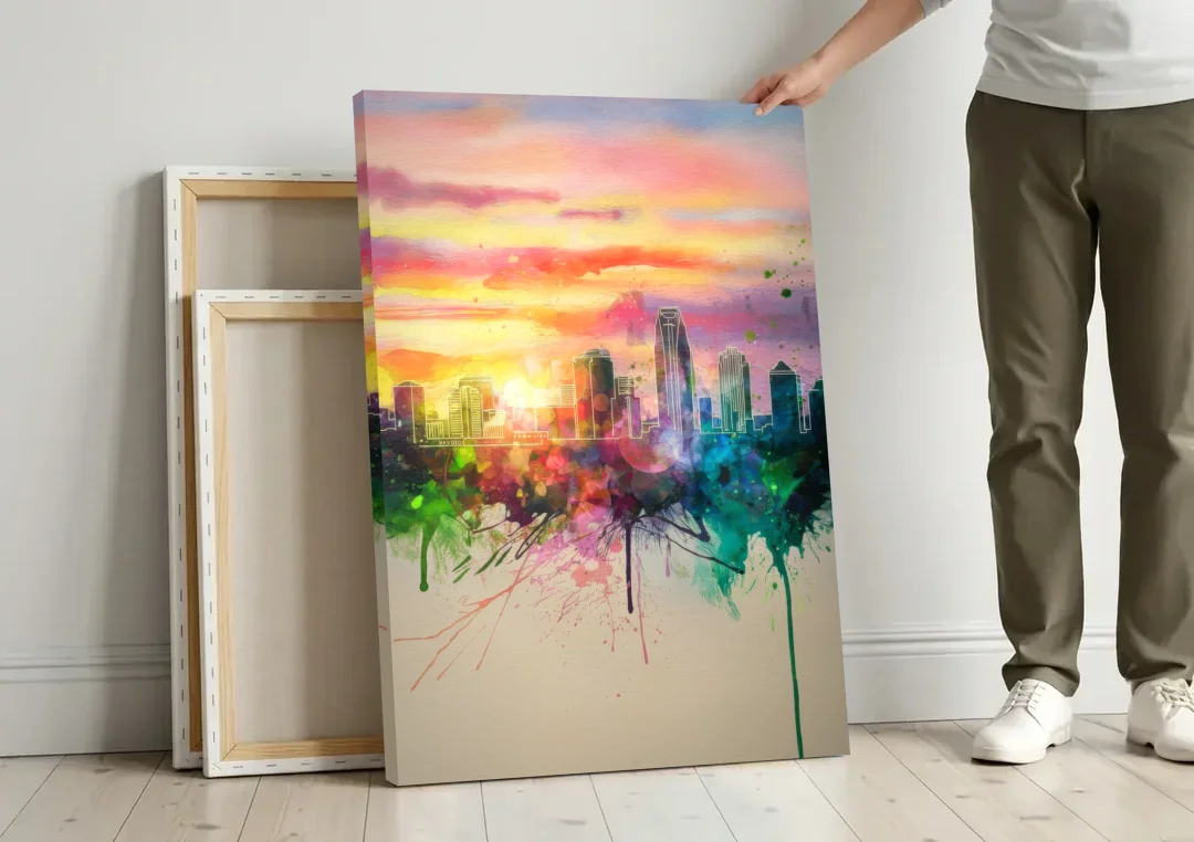 Charlotte Skyline at Sunset canvas wall art leaning against a wall next to blank canvases