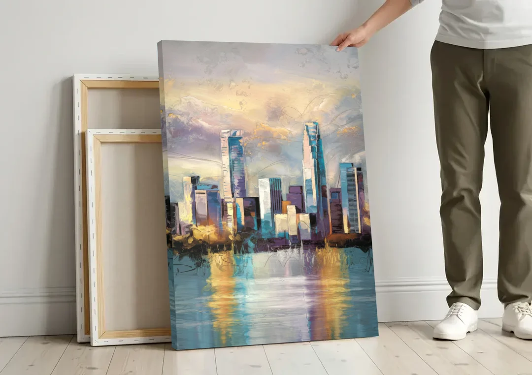 Charlotte Uptown Skyline canvas wall art leaning against a wall next to blank canvases