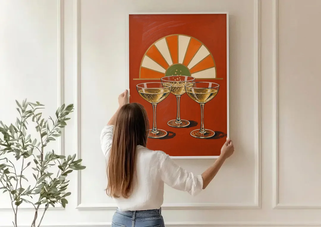 Cheers Wall Art with Three Champagne Coupes canvas wall art being hung on a paneled wall