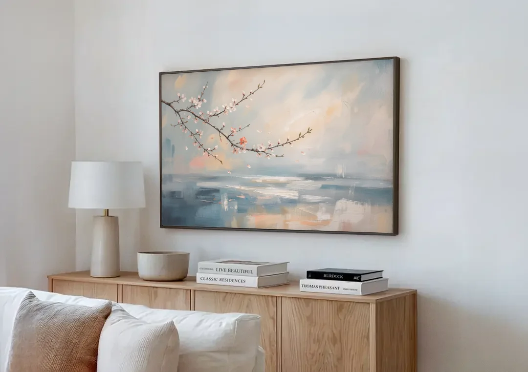 Abstract Cherry Blossom Branch Over Misty Sea canvas wall art above a wooden sideboard next to a sofa