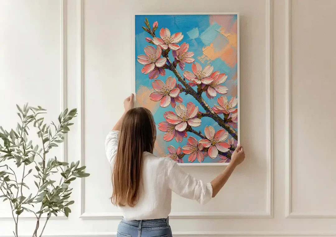 Cherry Blossom Branch Painting Against Turquoise Sky canvas wall art being hung on a paneled wall