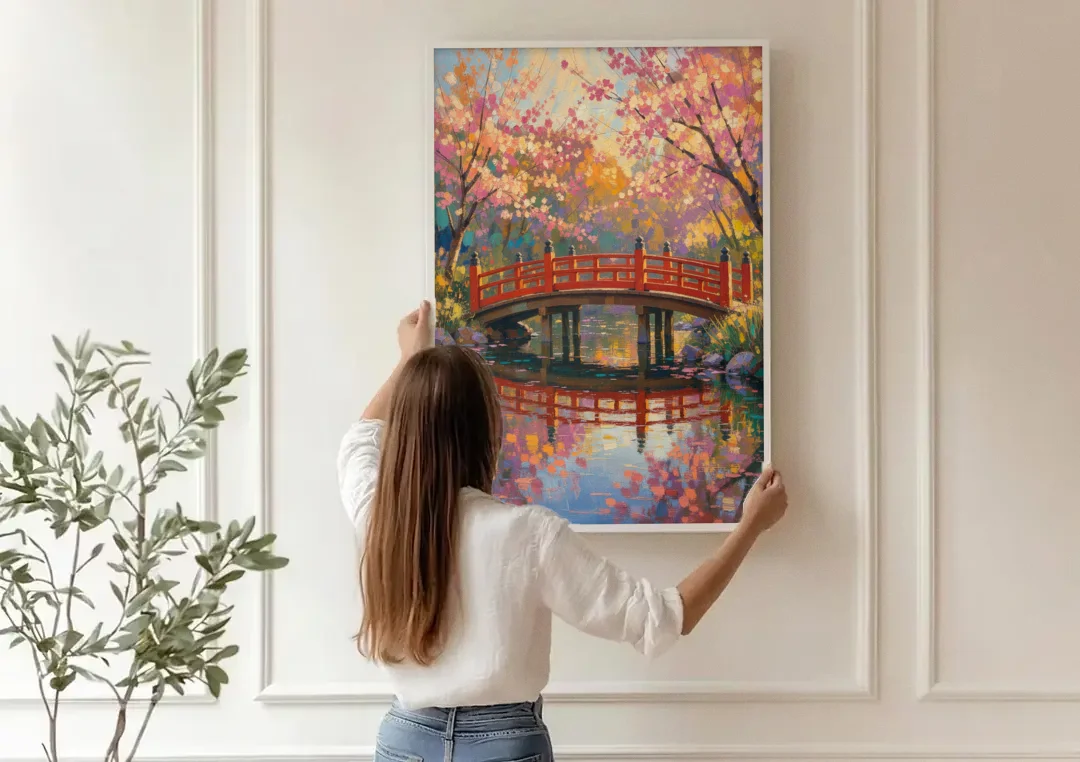 Cherry Blossom Bridge Painting canvas wall art being hung on a paneled wall
