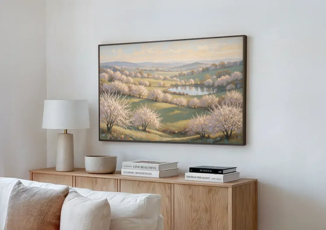 Cherry Blossom Landscape Painting with Valley Lake canvas wall art above a wooden sideboard next to a sofa