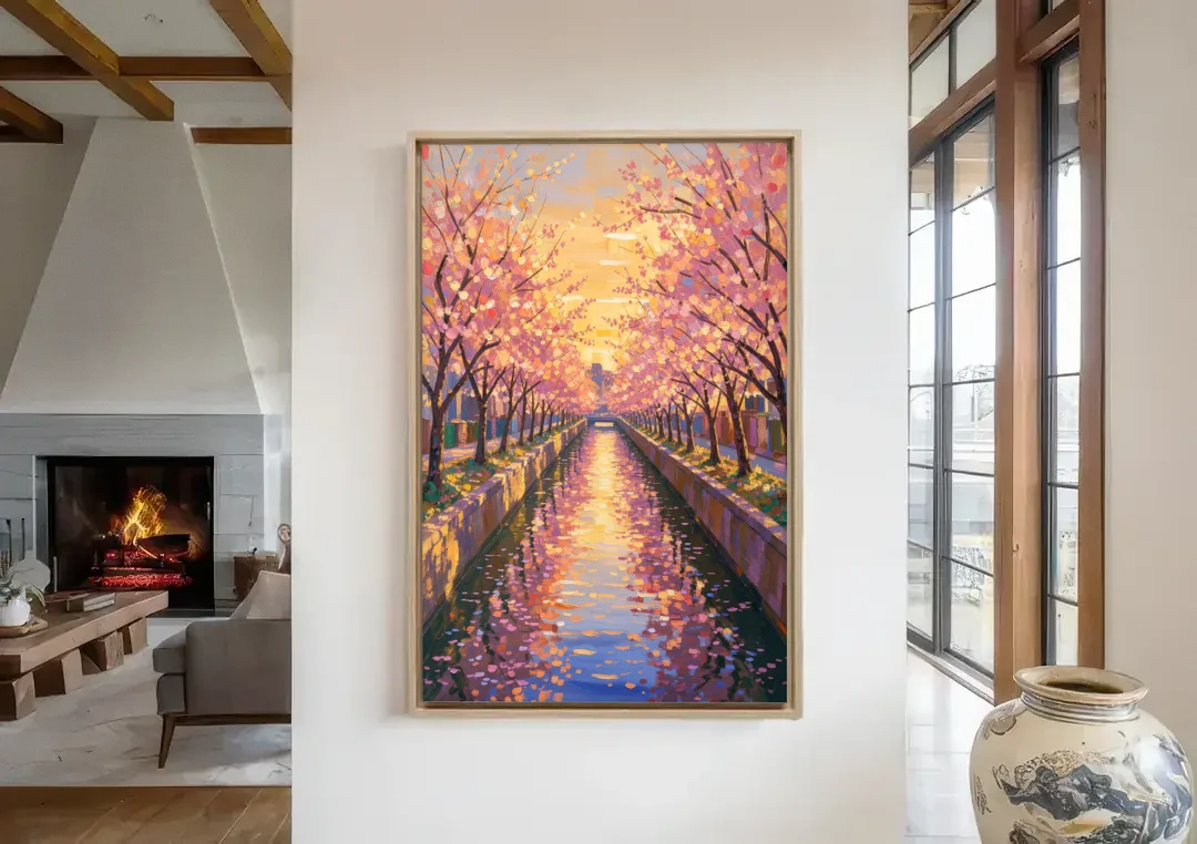 Cherry Blossom River Painting at Sunset canvas wall art in a living room with a fireplace