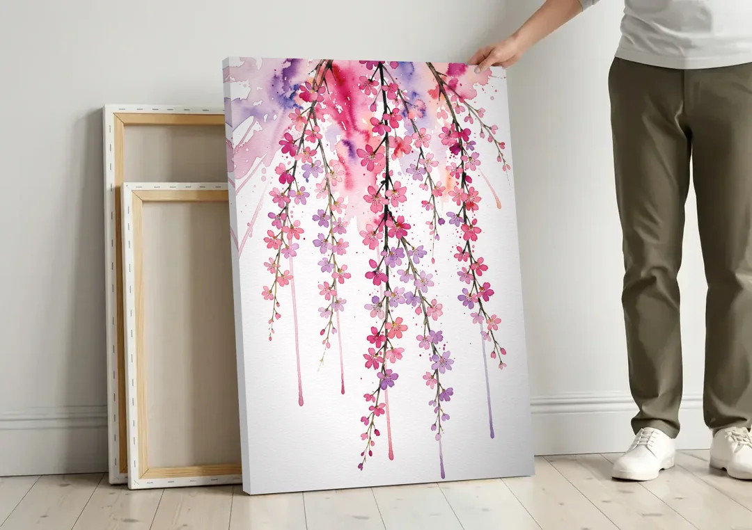Cherry Blossom Watercolor of Weeping Strands canvas wall art leaning against a wall next to blank canvases