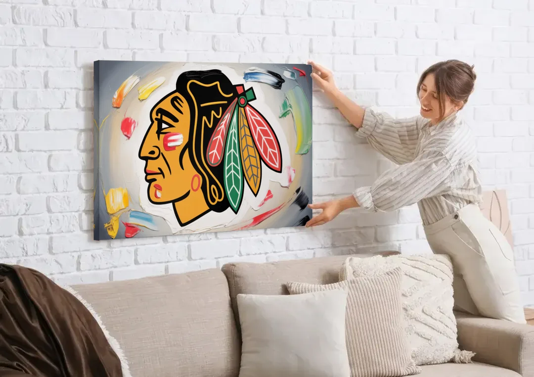 Chicago Blackhawks Classic Logo Redux canvas wall art being hung on a white brick wall above a sofa