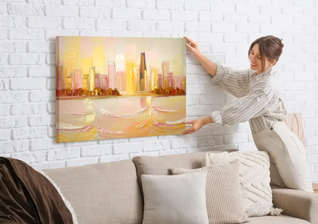 Chicago Cityscape At Dawn canvas wall art being hung on a white brick wall above a sofa