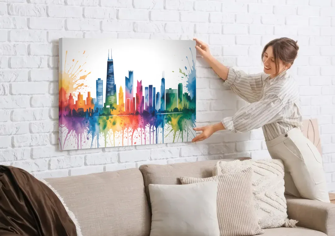 Chicago Watercolor Skyline Splash canvas wall art being hung on a white brick wall above a sofa