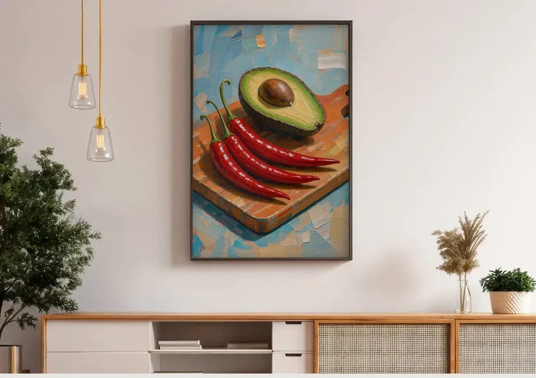 Chili Pepper Wall Art with Avocado on a Cutting Board canvas wall art above a wooden sideboard under pendant lights