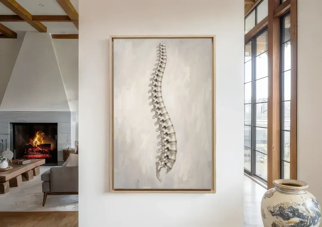 Chiropractic Wall Art of a Spine in Misty Grey canvas wall art in a living room with a fireplace