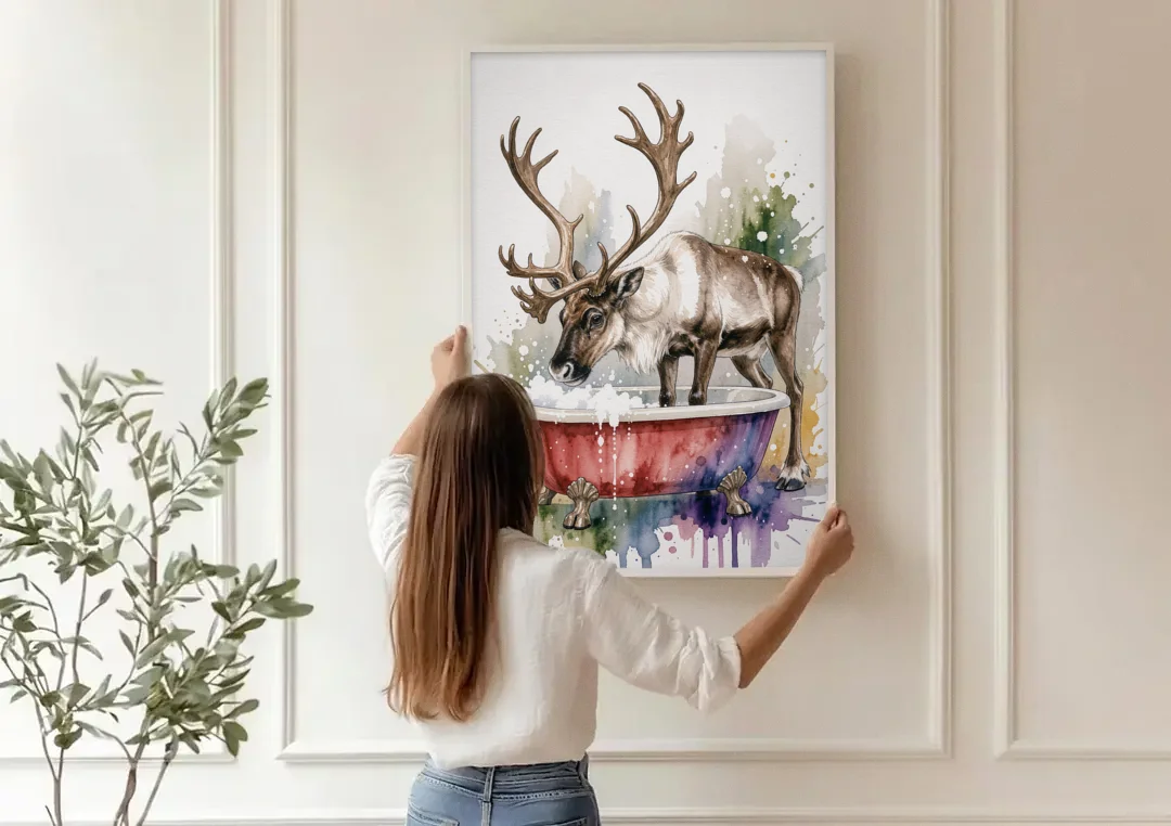 Christmas Bathroom Wall Art Reindeer Sniffing the Bubbles canvas wall art being hung on a paneled wall