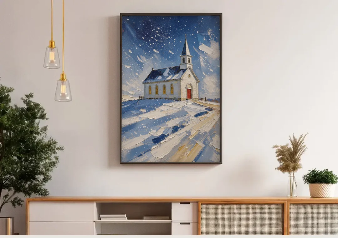Christmas Eve Painting of a Hilltop Chapel canvas wall art above a wooden sideboard under pendant lights