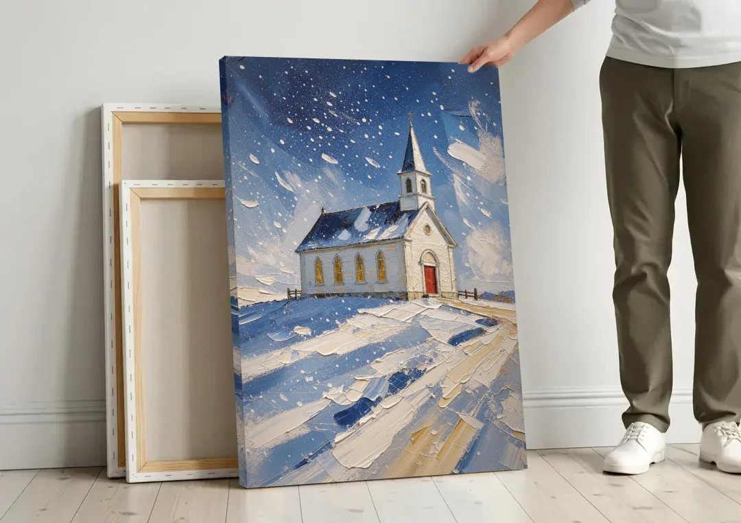 Christmas Eve Painting of a Hilltop Chapel canvas wall art leaning against a wall next to blank canvases