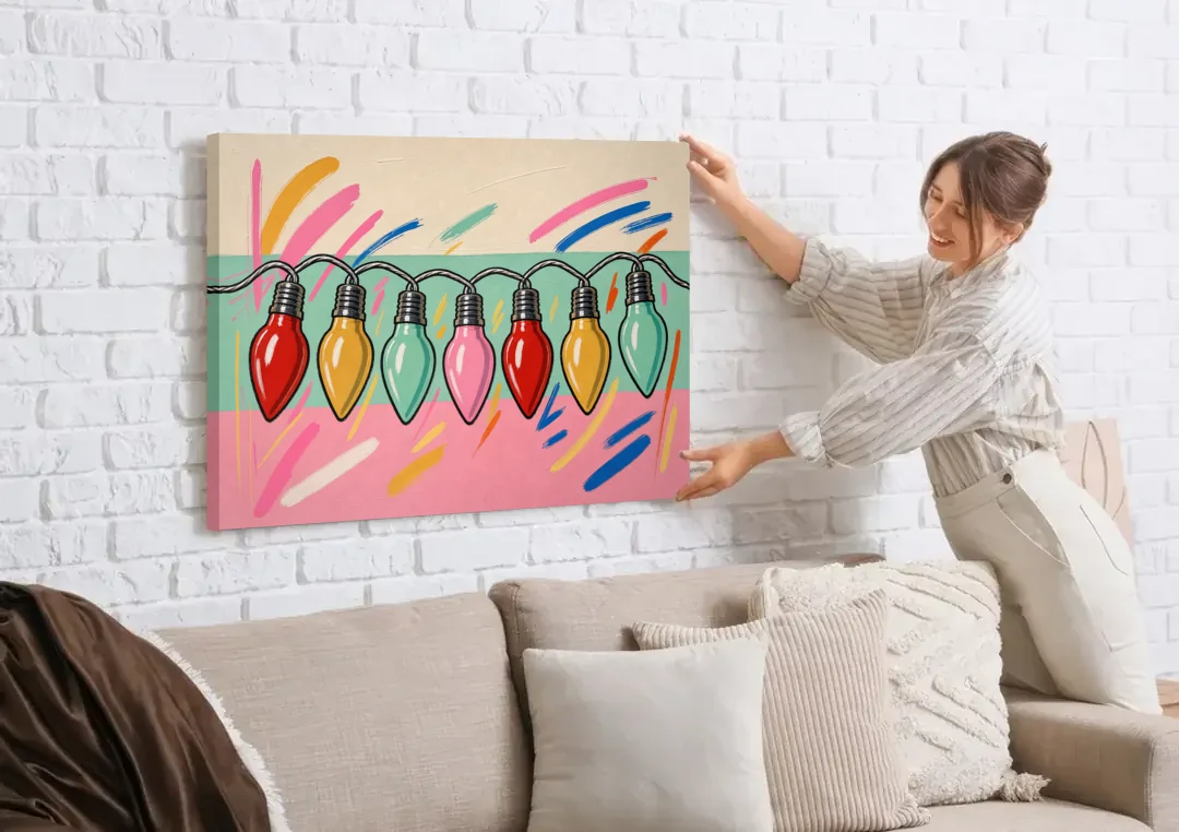 Christmas Gallery Wall Art with Swooping C9 Bulbs canvas wall art being hung on a white brick wall above a sofa