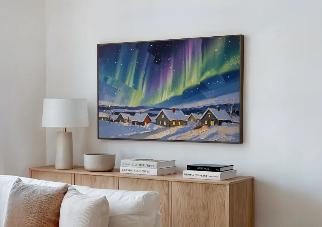 Christmas Landscape Painting Under Northern Lights canvas wall art above a wooden sideboard next to a sofa