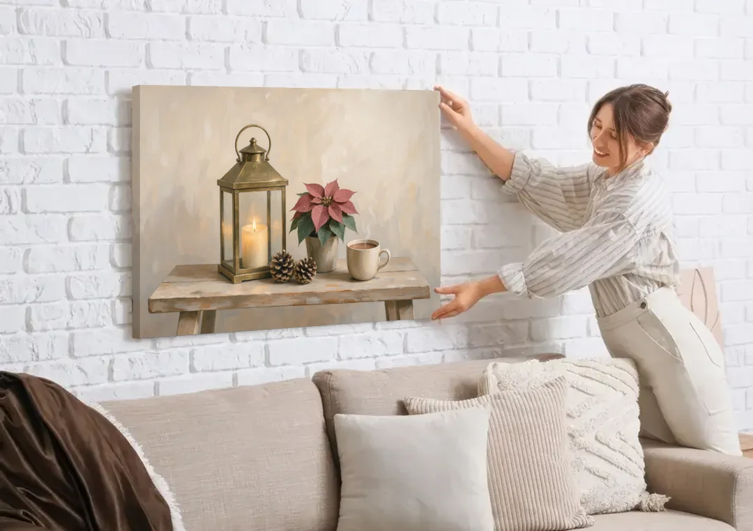 Christmas Lantern Painting with Cocoa and Poinsettia canvas wall art being hung on a white brick wall above a sofa