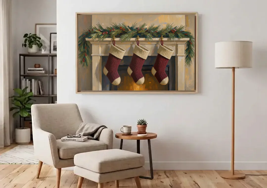 Christmas Mantel Painting with Three Knit Stockings canvas wall art above an armchair in a bright living room