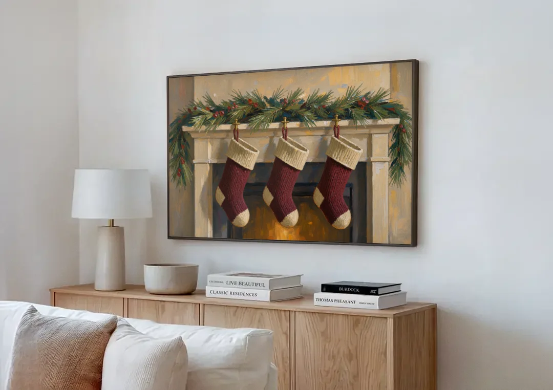 Christmas Mantel Painting with Three Knit Stockings canvas wall art above a wooden sideboard next to a sofa