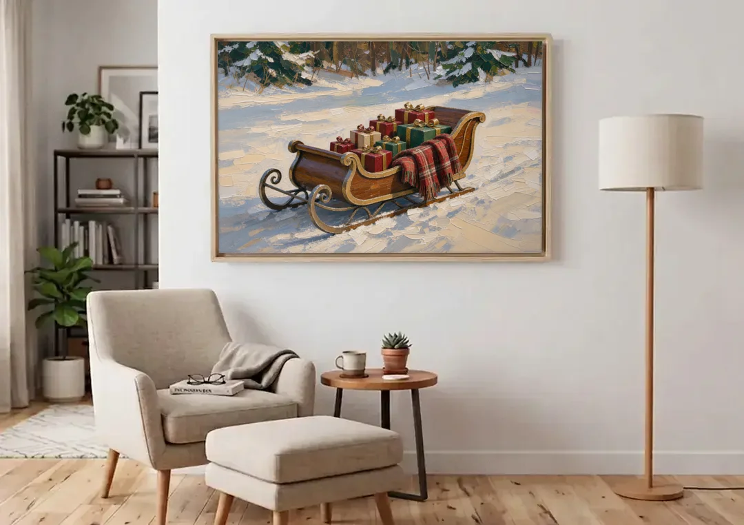 Christmas Sleigh Painting with Plaid Blanket canvas wall art above an armchair in a bright living room