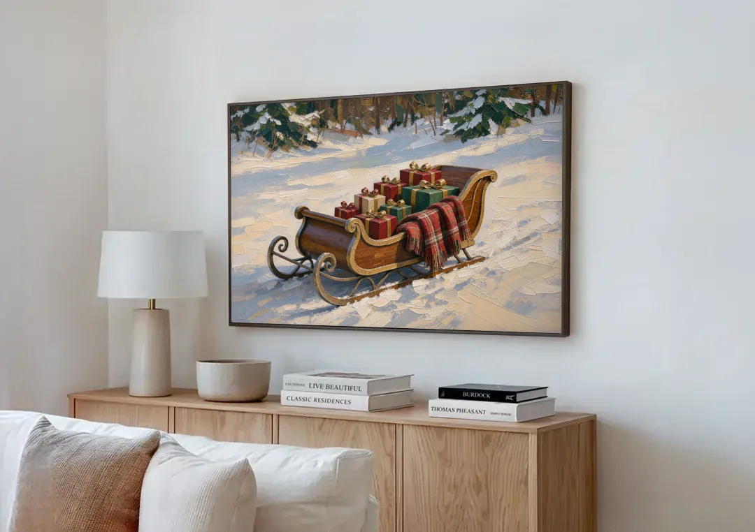 Christmas Sleigh Painting with Plaid Blanket canvas wall art above a wooden sideboard next to a sofa