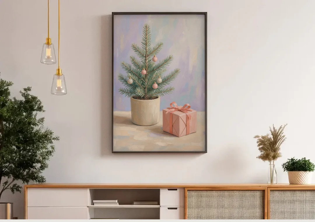 Christmas Tree Art Print with Pink Gift canvas wall art above a wooden sideboard under pendant lights