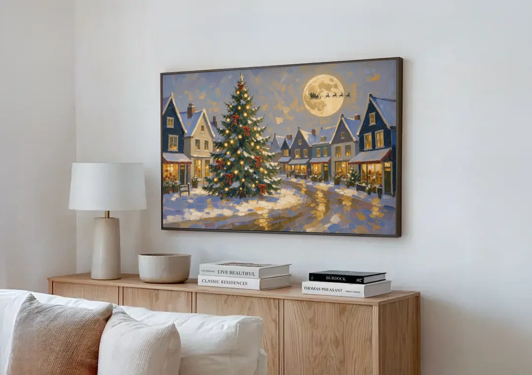 Christmas Village Wall Art with the Moonlit Tree Square canvas wall art above a wooden sideboard next to a sofa