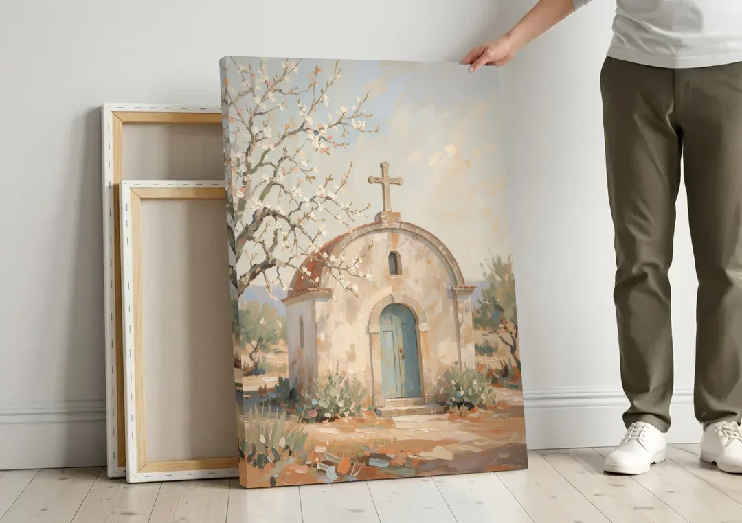 Church Wall Art of a Chapel in Almond Blossom canvas wall art leaning against a wall next to blank canvases
