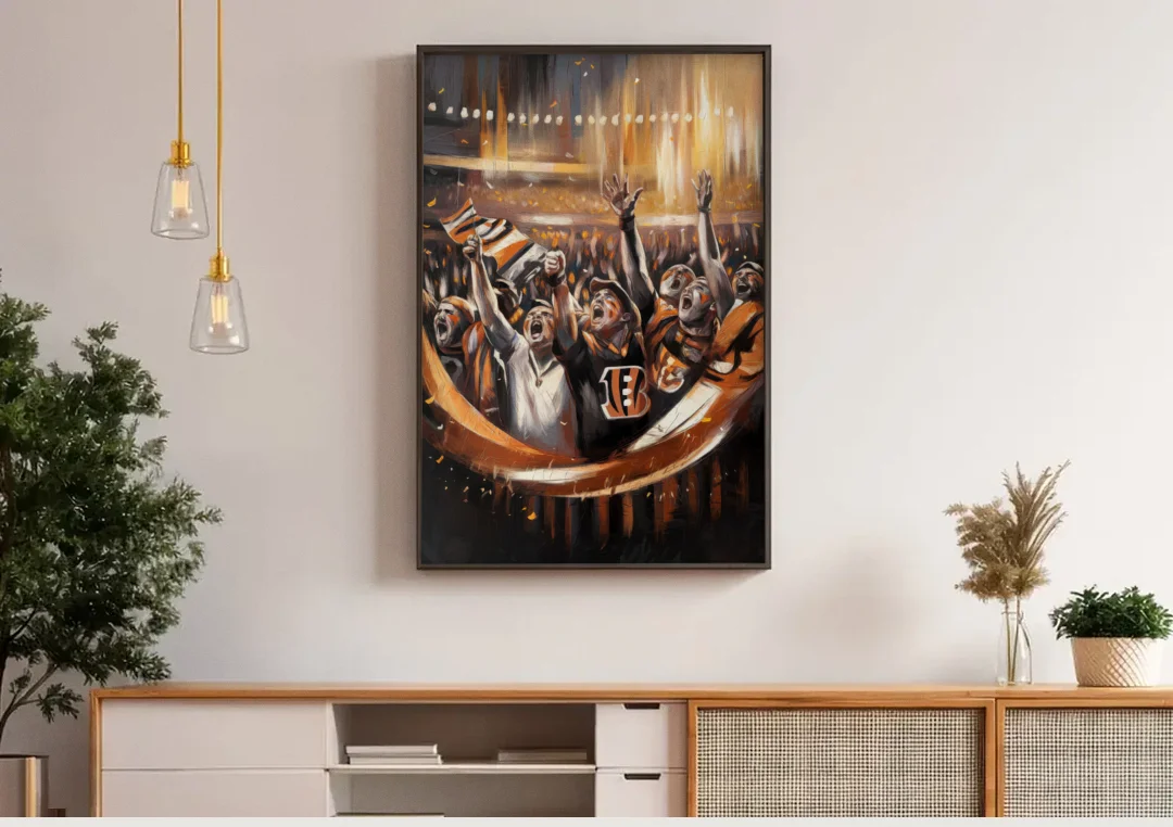 Cincinnati Bengals Fans in Action canvas wall art above a wooden sideboard under pendant lights
