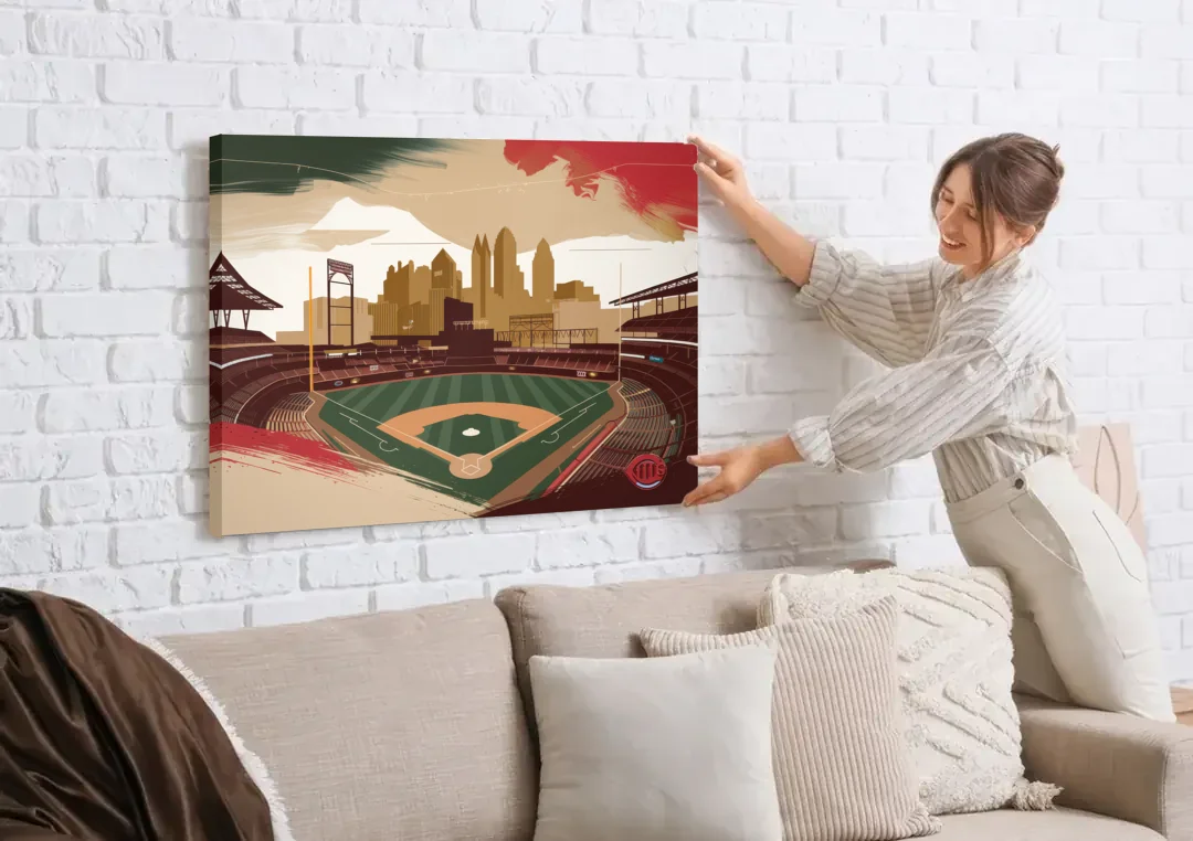 Cincinnati Reds Vintage Moments canvas wall art being hung on a white brick wall above a sofa