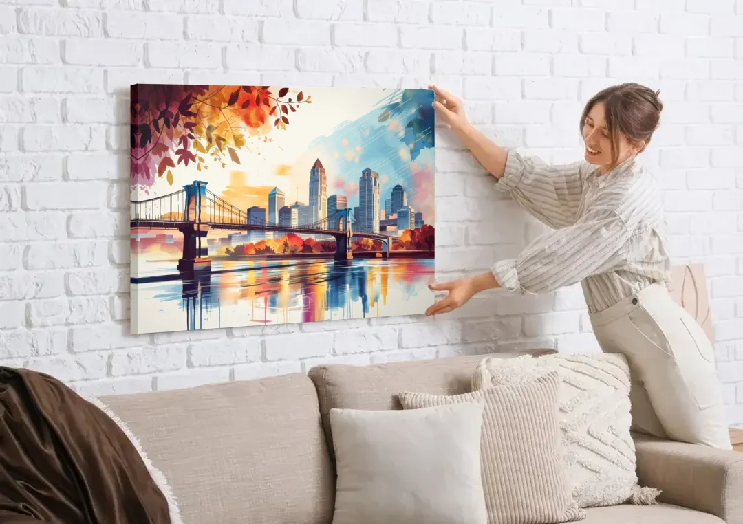 Cincinnati Skyline In Autumn canvas wall art being hung on a white brick wall above a sofa