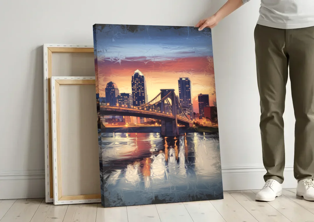 Cincinnati Skyline with River Reflection canvas wall art leaning against a wall next to blank canvases