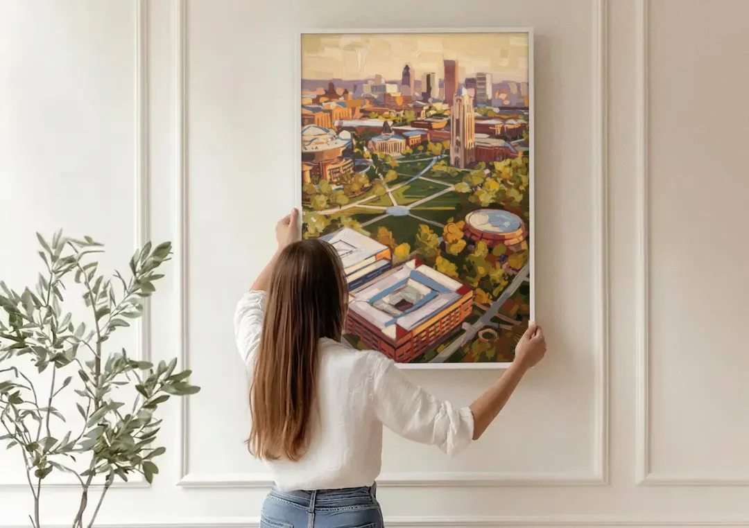 Cincinnati University Campus Highlights canvas wall art being hung on a paneled wall