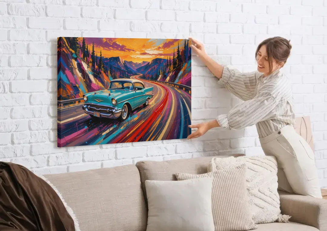 Classic Car Prints Coupe on a Mountain Curve canvas wall art being hung on a white brick wall above a sofa