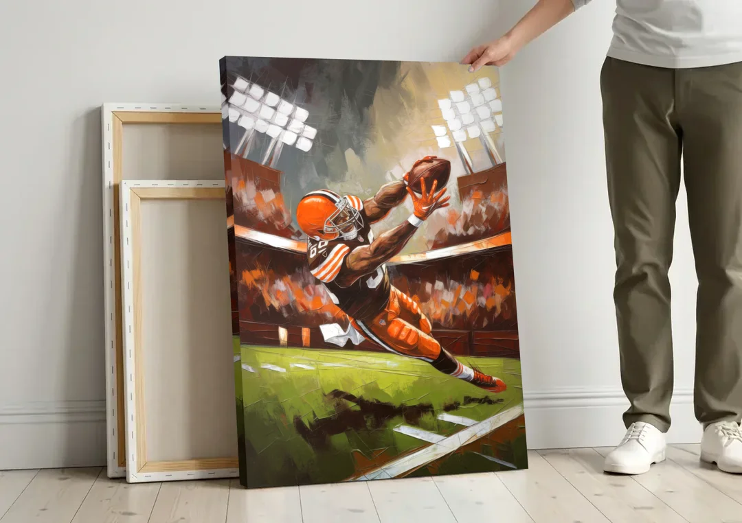 Cleveland Browns Fans in Action canvas wall art leaning against a wall next to blank canvases