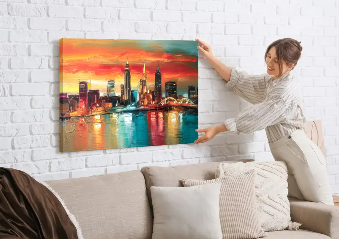 Cleveland Historic Landmarks Watercolor canvas wall art being hung on a white brick wall above a sofa