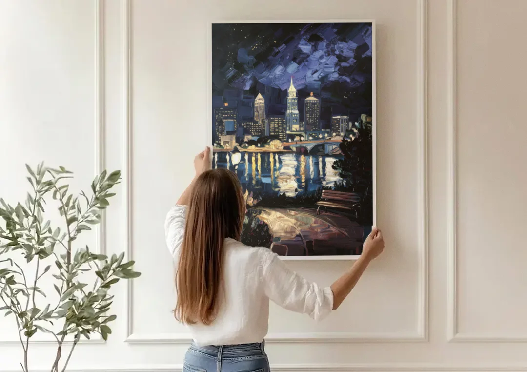 Cleveland Nighttime Lights canvas wall art being hung on a paneled wall