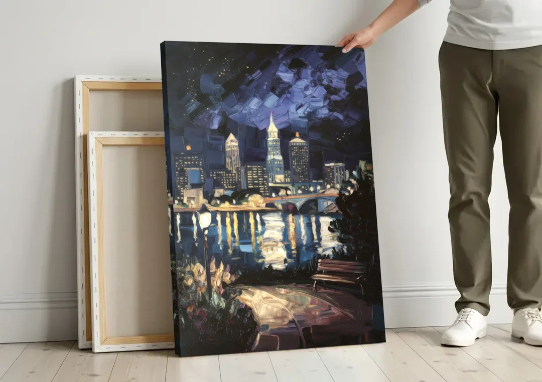 Cleveland Nighttime Lights canvas wall art leaning against a wall next to blank canvases