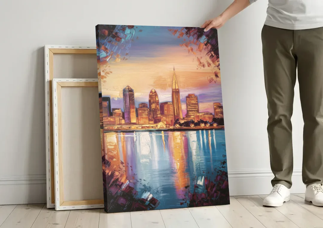 Cleveland Skyline Reflection canvas wall art leaning against a wall next to blank canvases