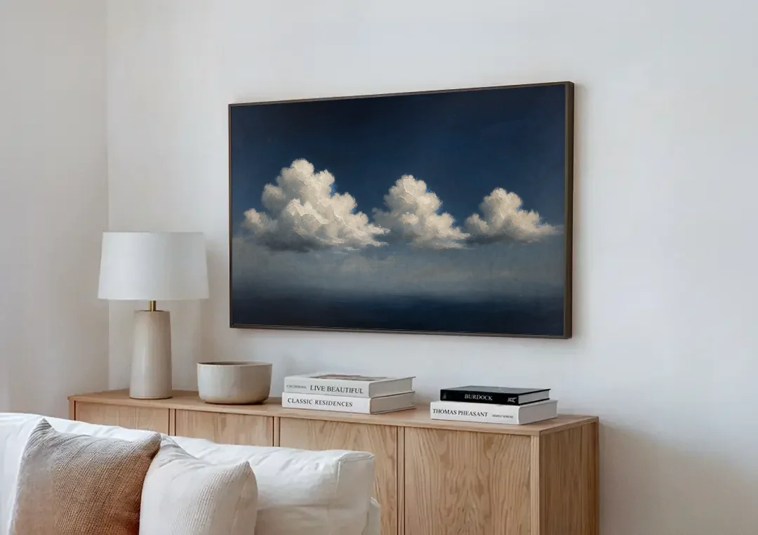 Cloud Wall Art with Three Moonlit Cumulus canvas wall art above a wooden sideboard next to a sofa