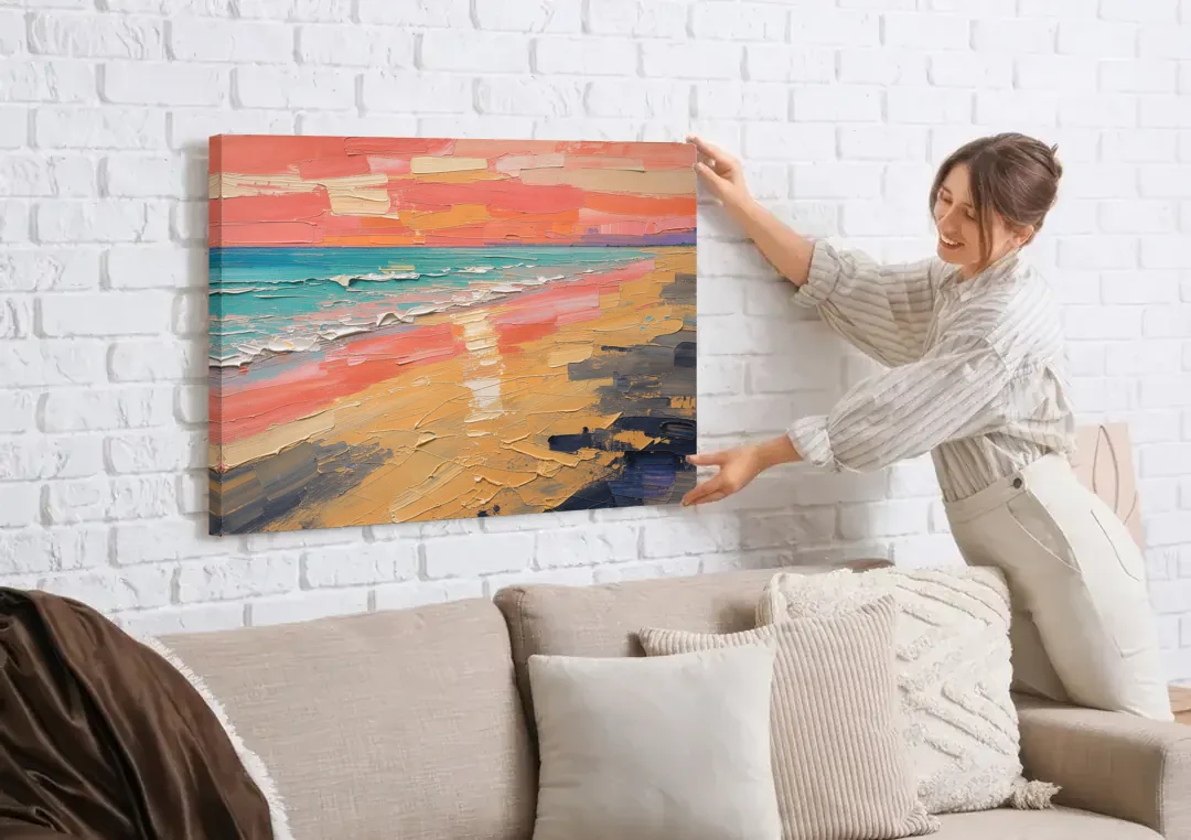 Coastal Abstract Low Tide Glow canvas wall art being hung on a white brick wall above a sofa