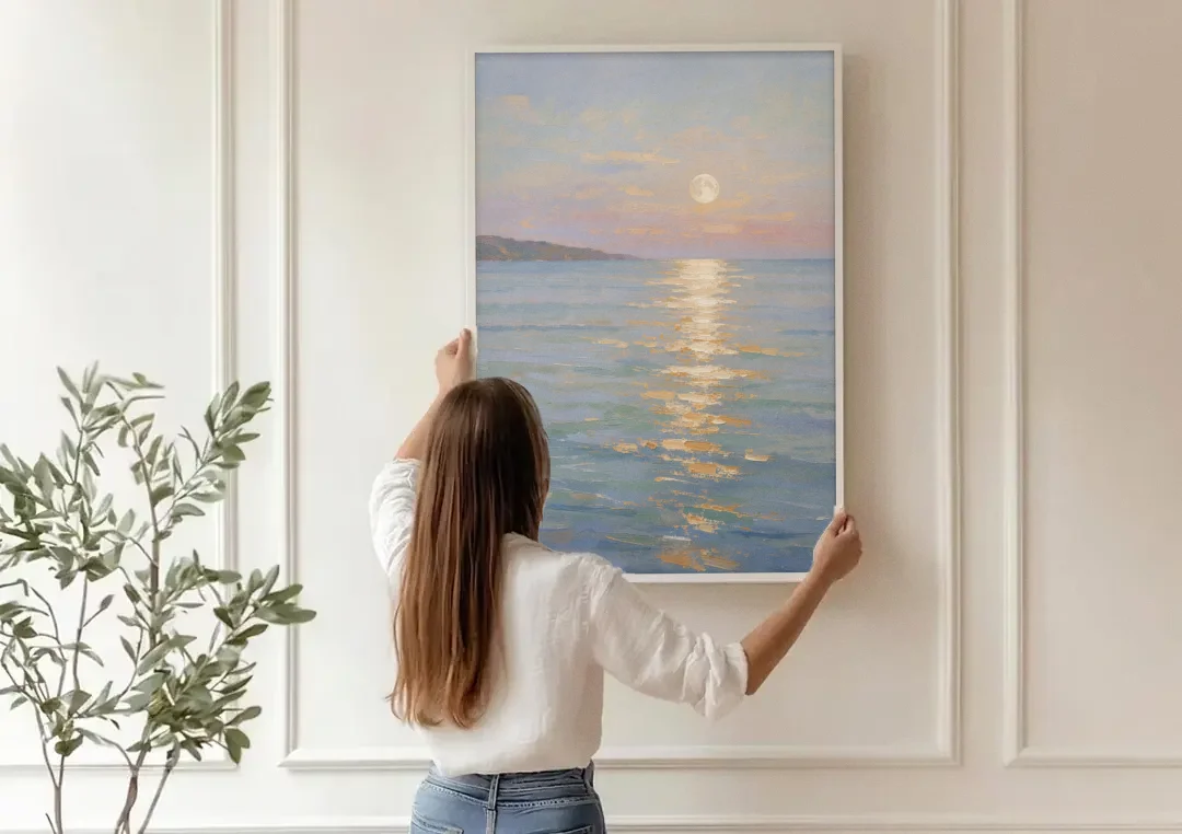 Coastal Art Prints Moon Path Over Calm Sea canvas wall art being hung on a paneled wall
