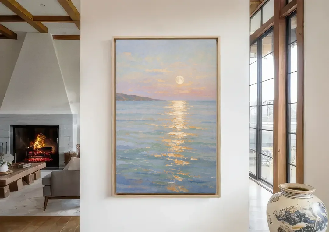 Coastal Art Prints Moon Path Over Calm Sea canvas wall art in a living room with a fireplace