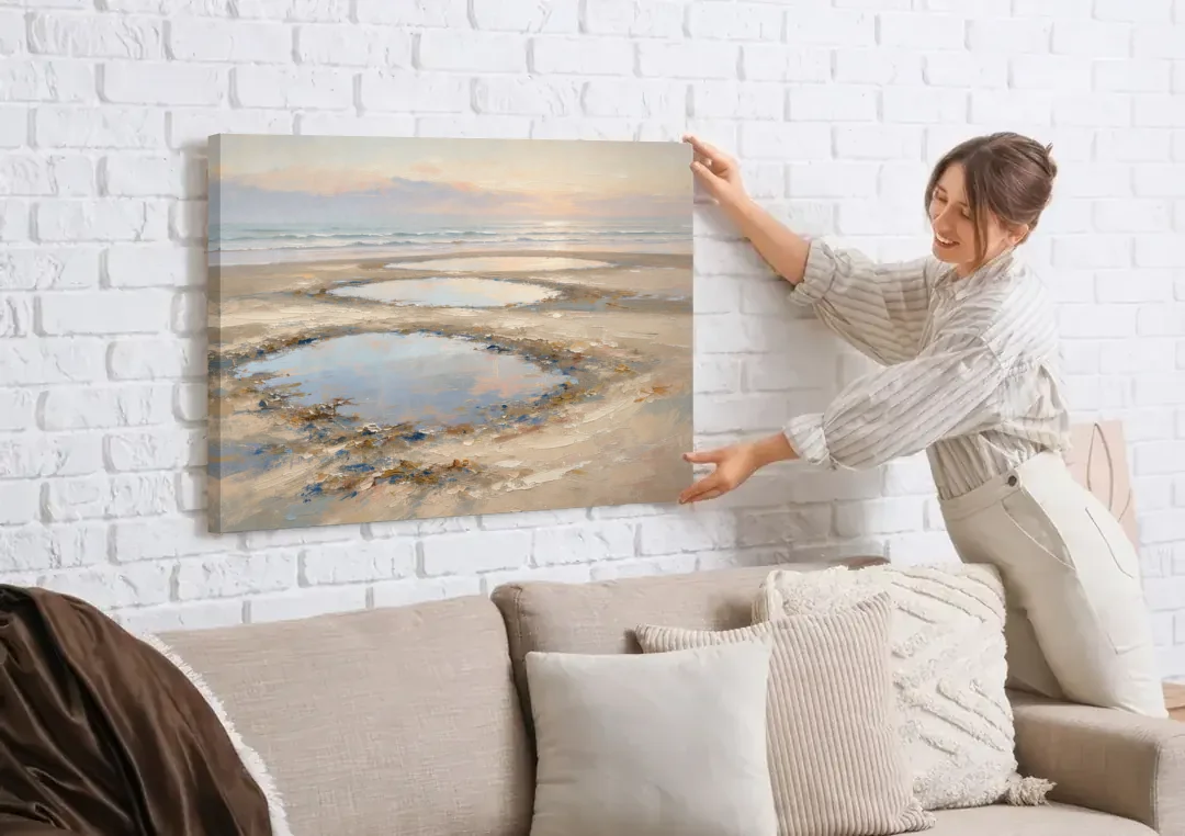 Coastal Bedroom Decor with Dawn Tide Pools canvas wall art being hung on a white brick wall above a sofa