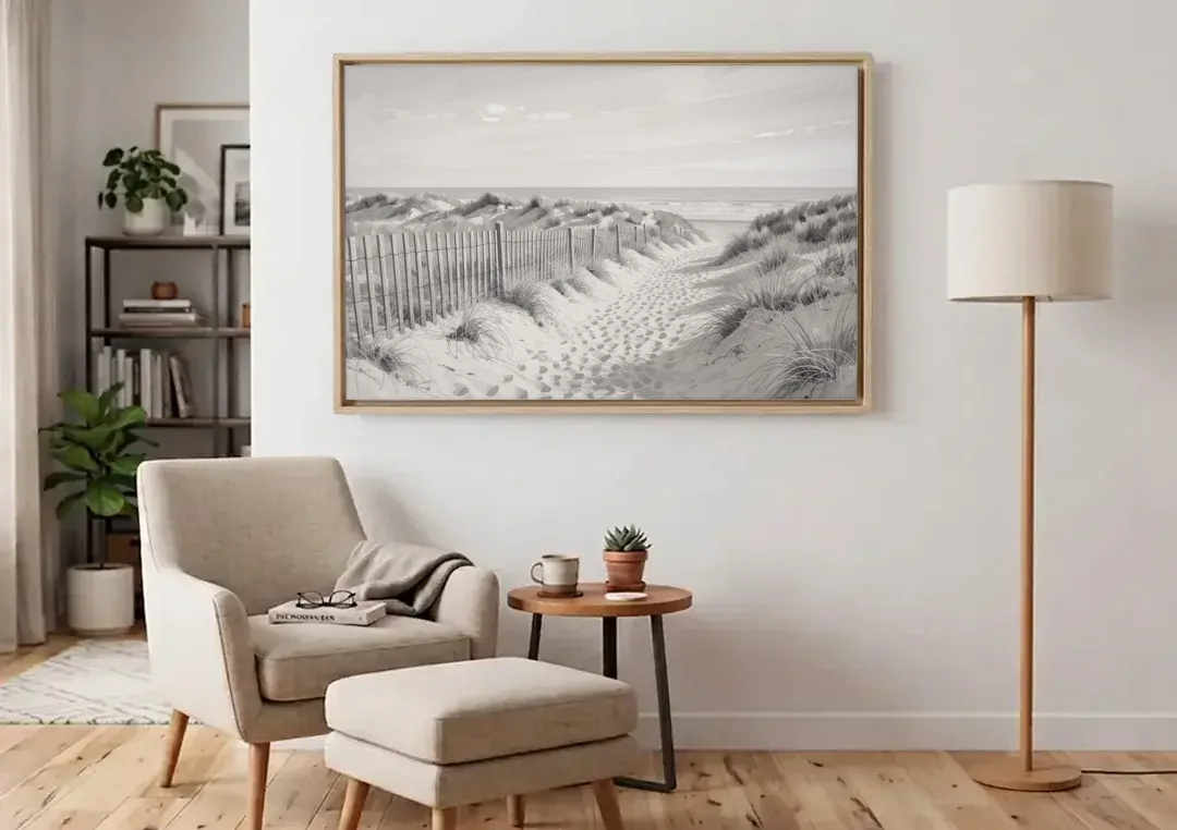 Coastal Black and White Dune Path to the Sea canvas wall art above an armchair in a bright living room