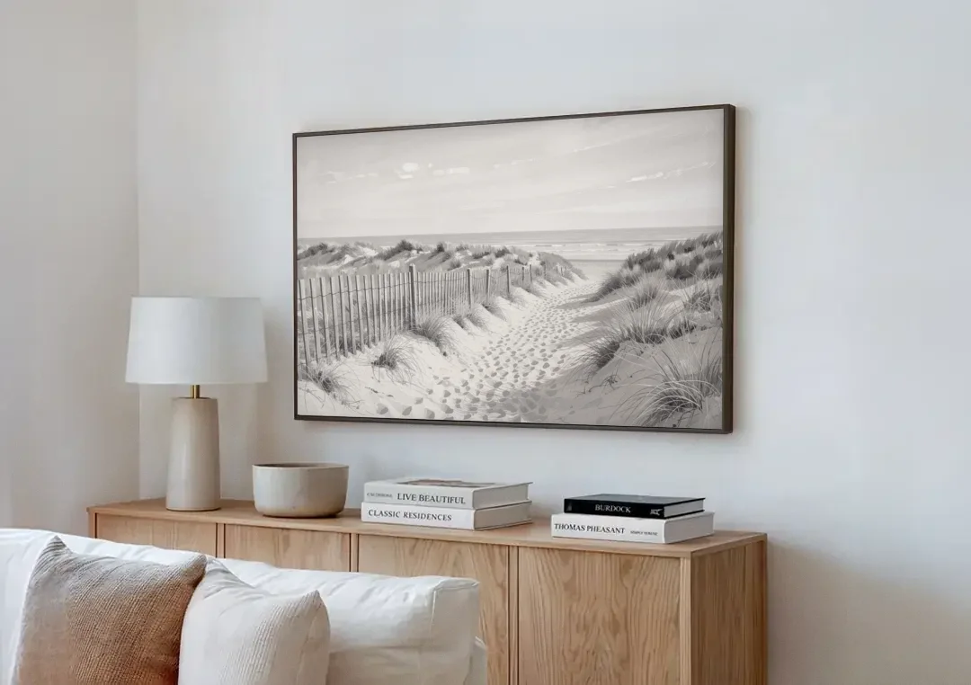 Coastal Black and White Dune Path to the Sea canvas wall art above a wooden sideboard next to a sofa