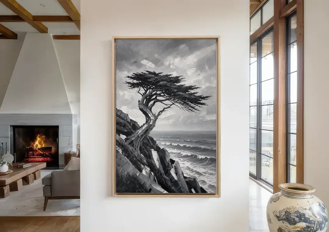 Coastal Black and White Windswept Cypress on the Cliff canvas wall art in a living room with a fireplace